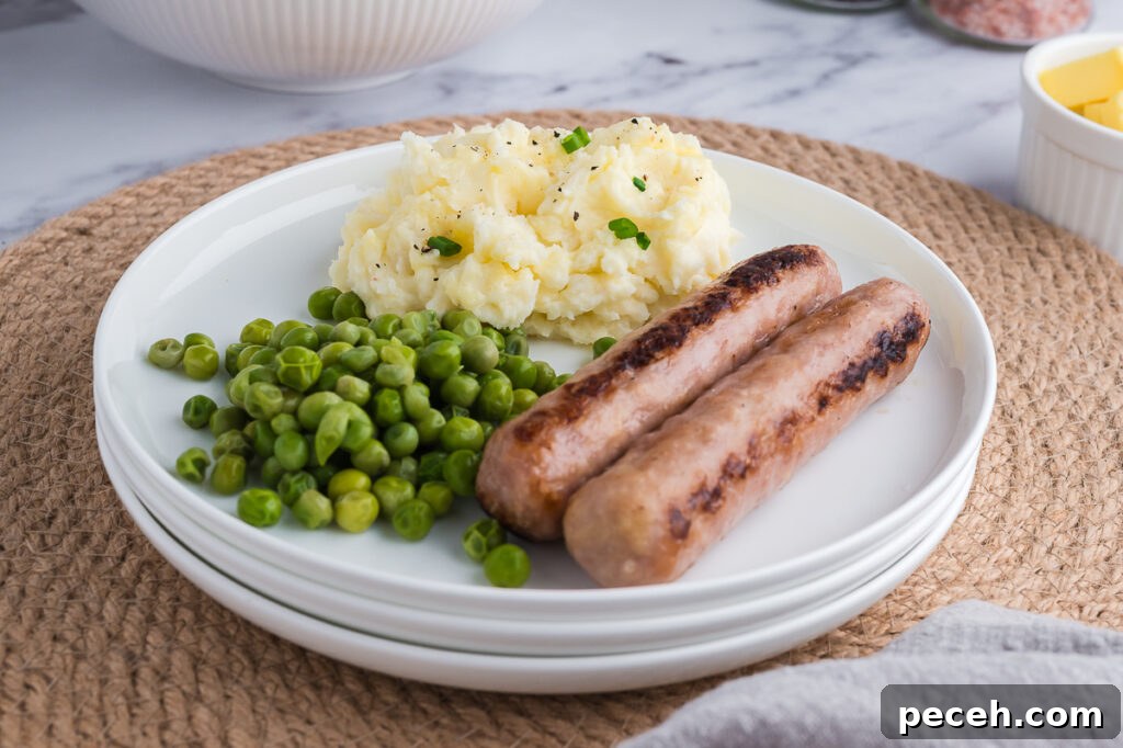 Is Butter Gluten-Free? What You Need to Know About Safety and Labels 3 Plate with gluten-free mashed potatoes, peas, and cooked sausages.
