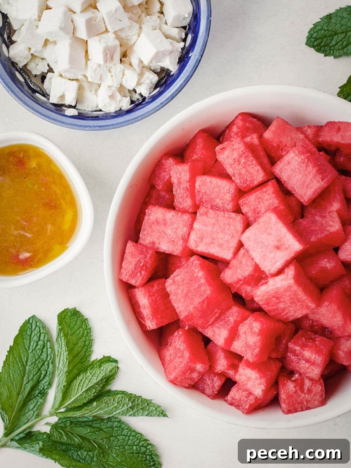 Ingredients needed to make watermelon feta salad with fresh mint.