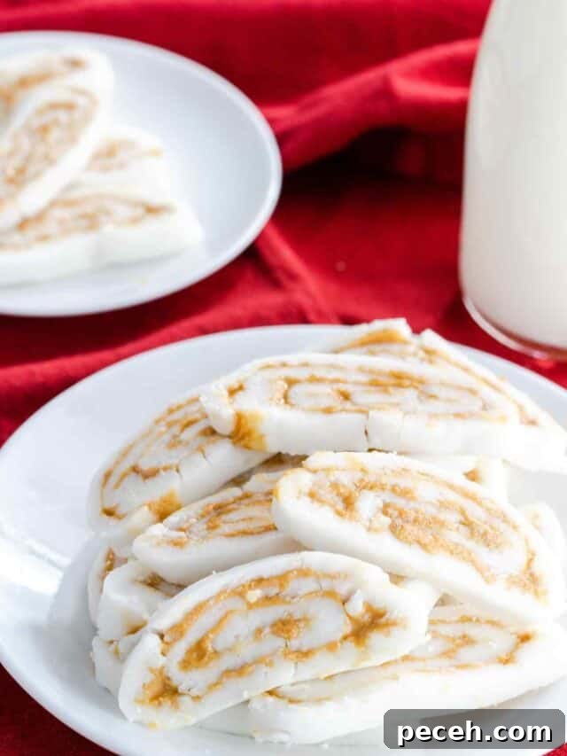 A plate of old fashioned potato candy with a glass of milk.