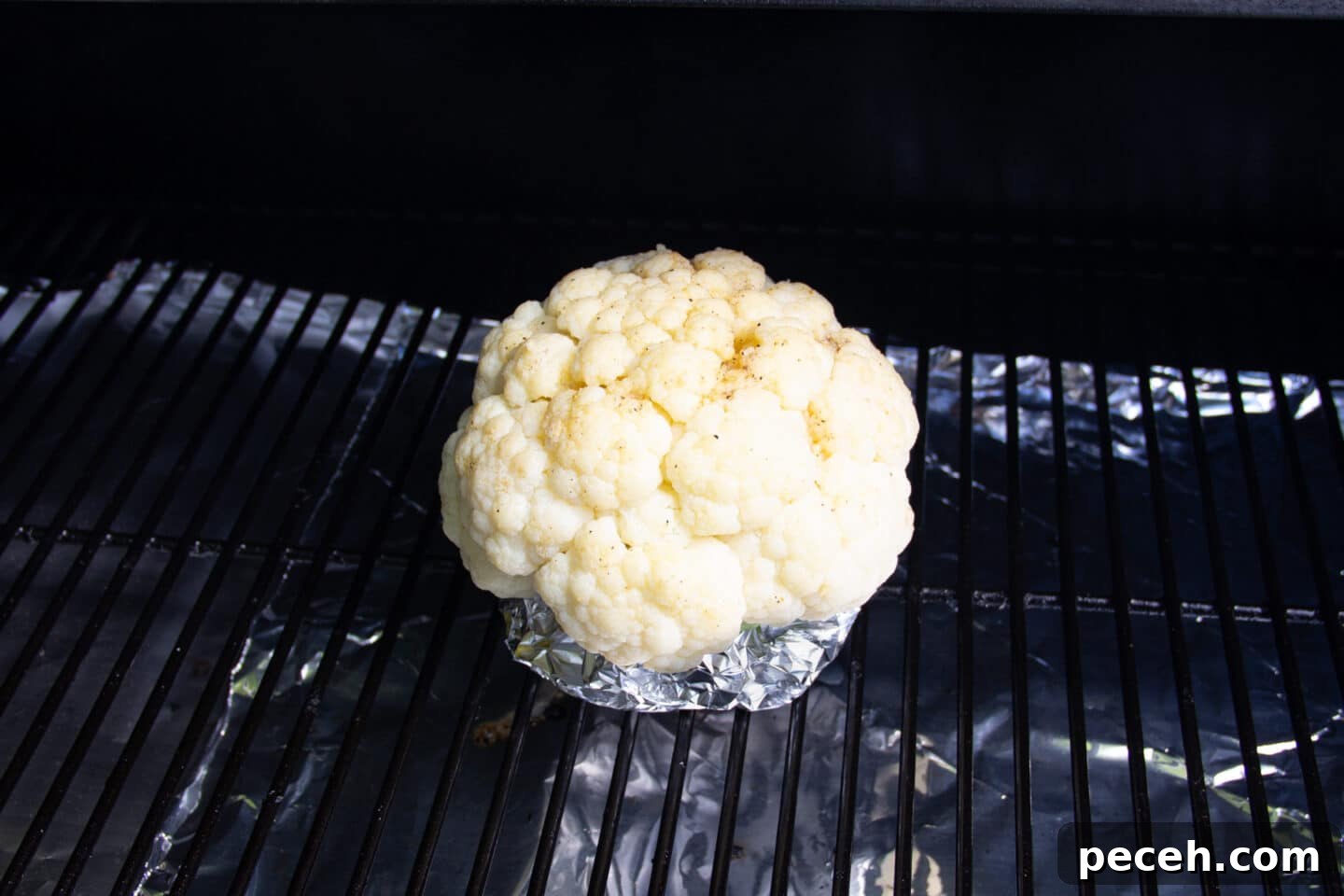 Smoked Cauliflower Recipe: Tender, Smoky Vegetable Side Dish 7 Picture of cauliflower on the smoker.