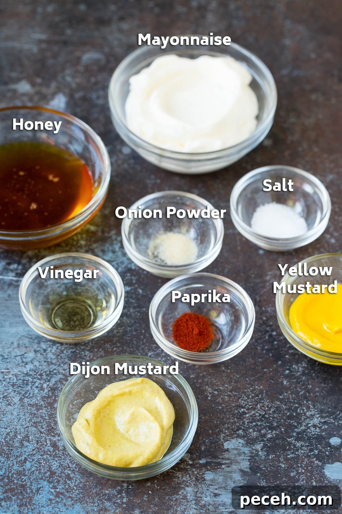 Homemade Honey Mustard Sauce Recipe for Dipping and Dressing 2 Bowls of mayonnaise, mustard, honey and seasonings.