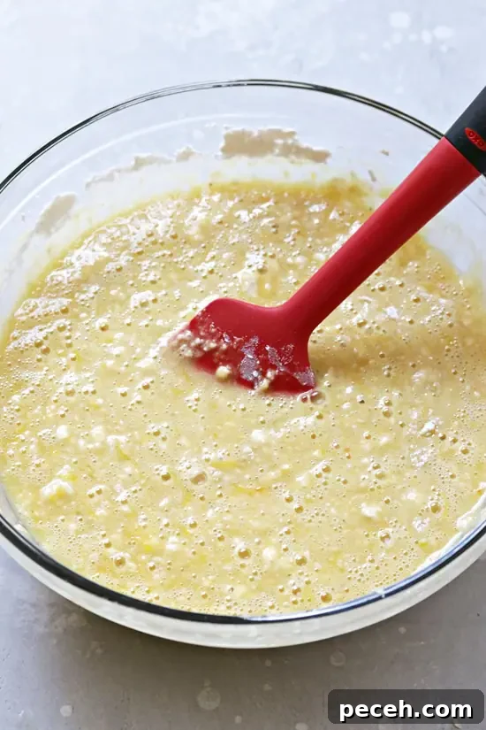 Dairy-Free Lemon Drizzle Cake Recipe — Zesty Moist Loaf 3 Cake batter in a mixing bowl.