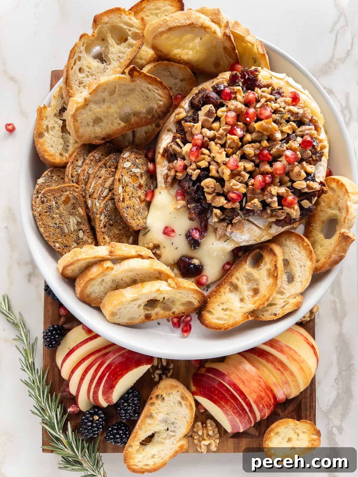 Baked Brie with Caramelized Dates and Toasted Walnuts 65 Baked Brie cheese covered in chopped dates and walnuts and a sprinkling of pomegranate seeds.