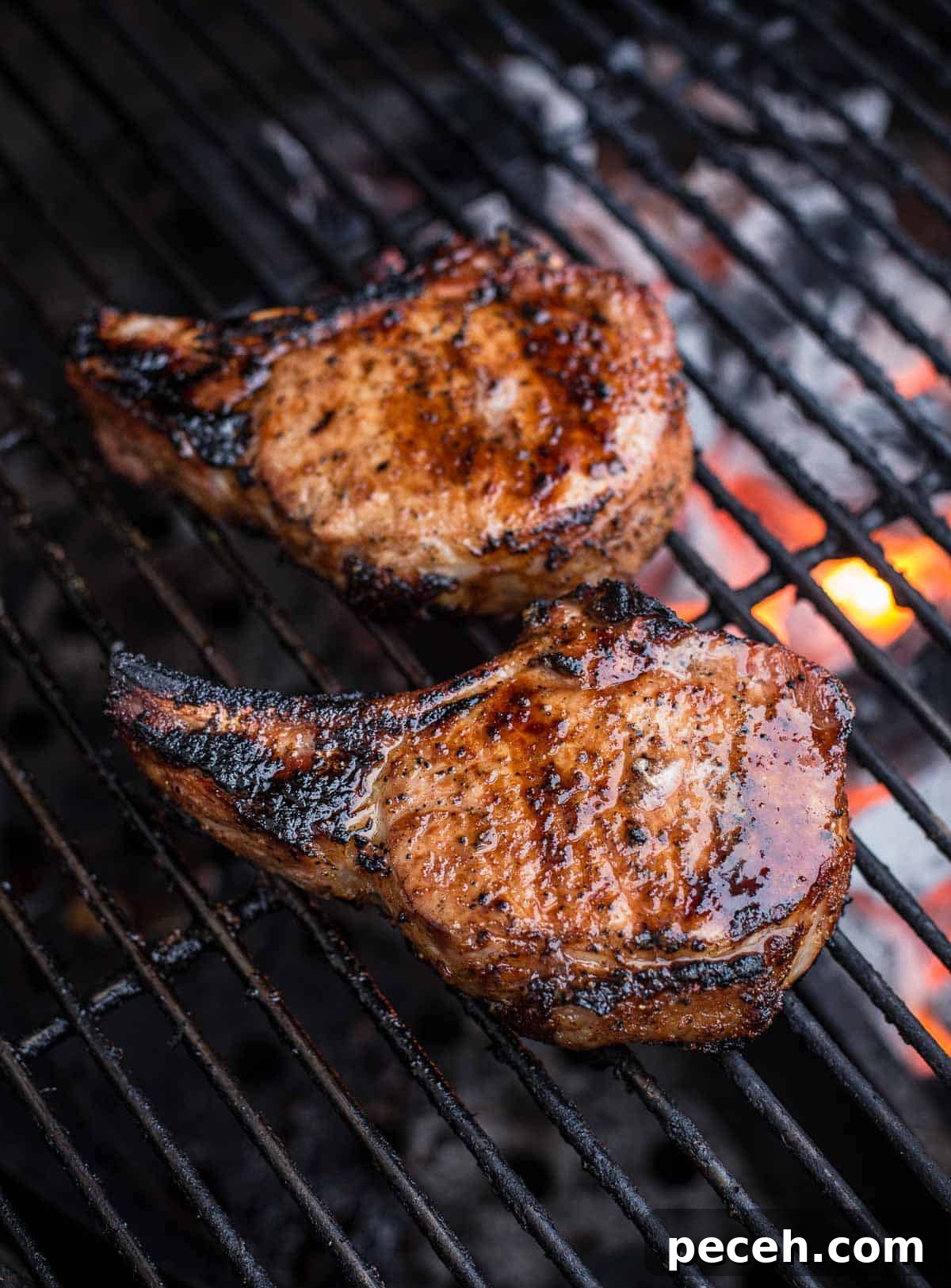 Pork Chops Explained: Types, Cooking Tips, and Serving Ideas 2 Grilled tomahawk pork chops over direct heat.