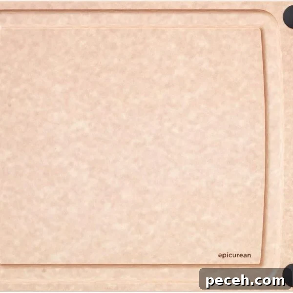 A rectangular, light brown cutting board with a smooth surface, four black non-slip corners, and a small hole on the left side. The brand name epicurean is printed in the lower right corner.