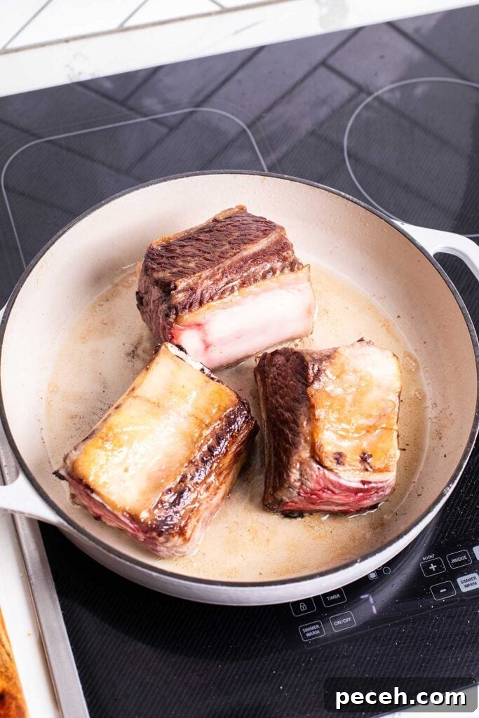 Braised Beef Short Rib Ragu Recipe — Slow-Cooked Italian Comfort 4 Step 1 is browning the short ribs until a deep brown color is formed.