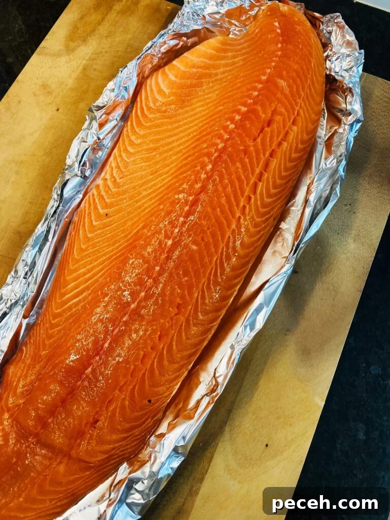 Honey Sriracha Salmon on the Traeger Grill: Sticky Spicy Glaze Recipe 2 salmon tented in foil before cooking