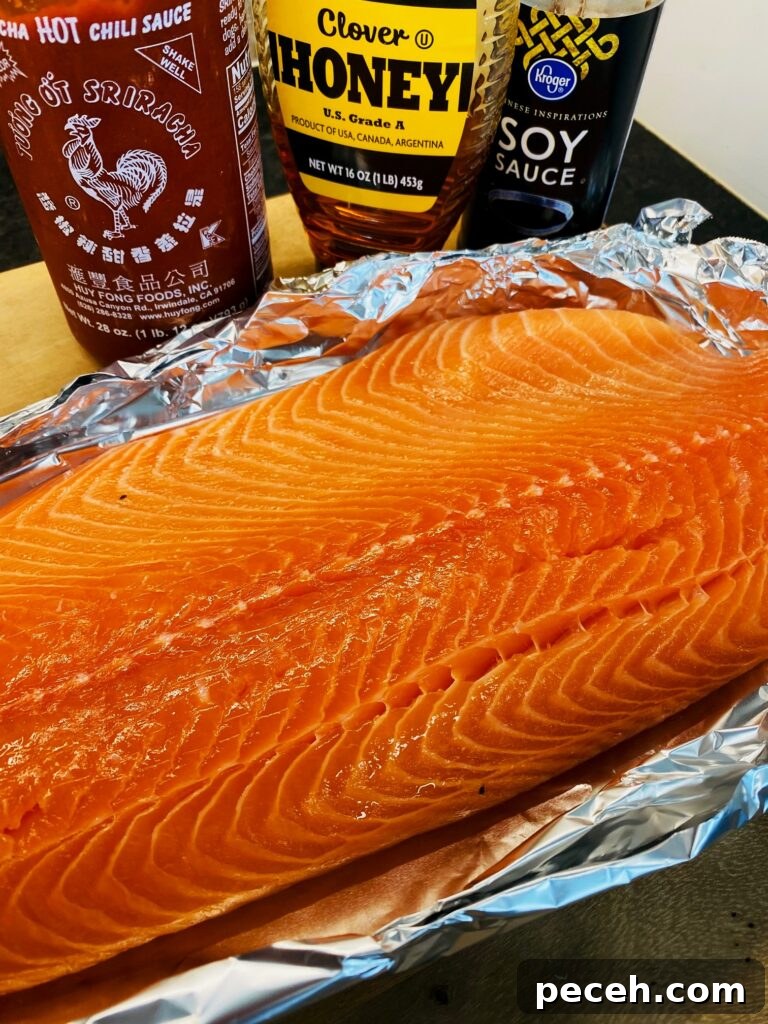 Honey Sriracha Salmon on the Traeger Grill: Sticky Spicy Glaze Recipe 3 salmon with sauce ingredients