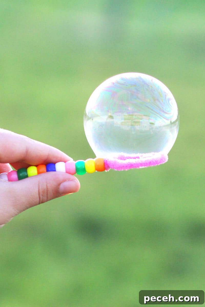 How to Make Long-Lasting Soap Bubbles with Glycerin 2 a bubble on a homemade bubble wand