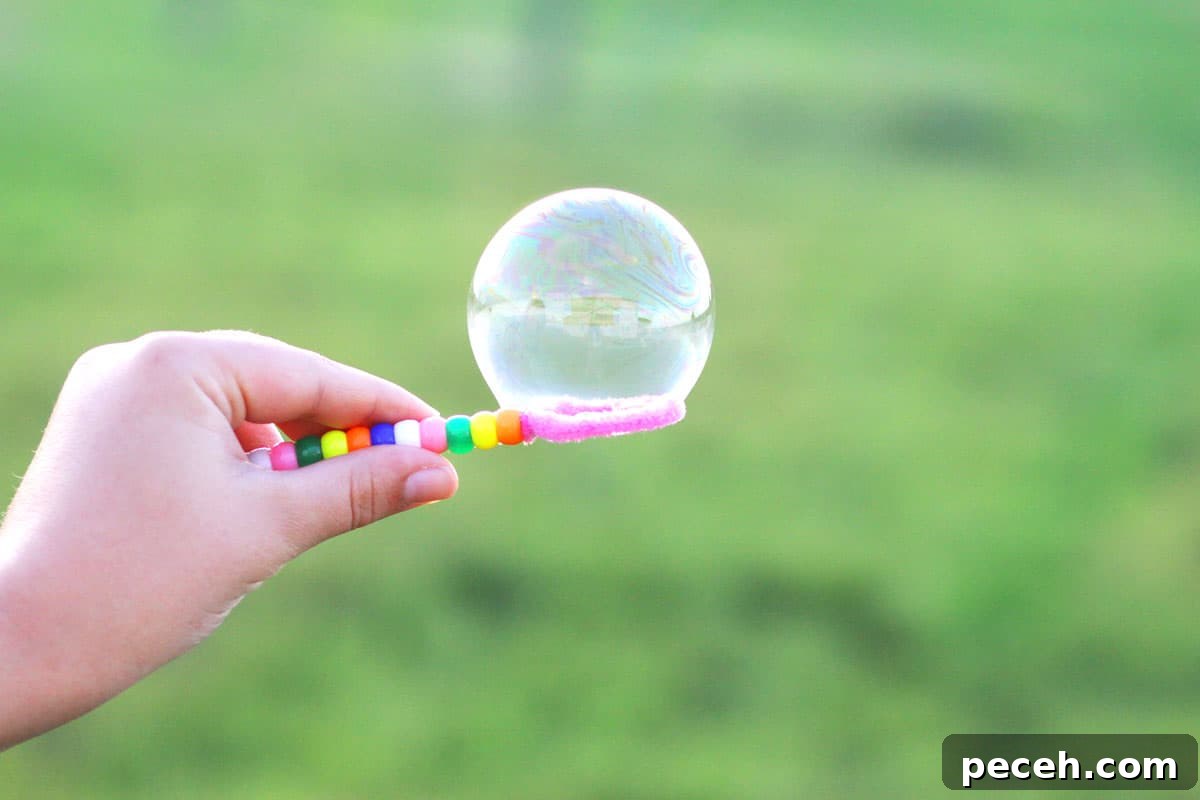 How to Make Long-Lasting Soap Bubbles with Glycerin 5 a bubble on a homemade bubble wand