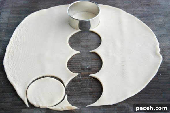 Mini Pumpkin Pies: Perfect Single-Serve Fall Desserts 4 cutting out dough into circles.