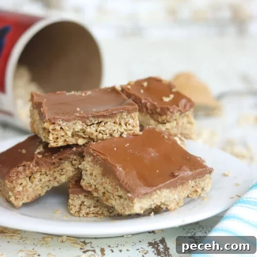 Stack of oatmeal bar cookies with chocolate frosting.