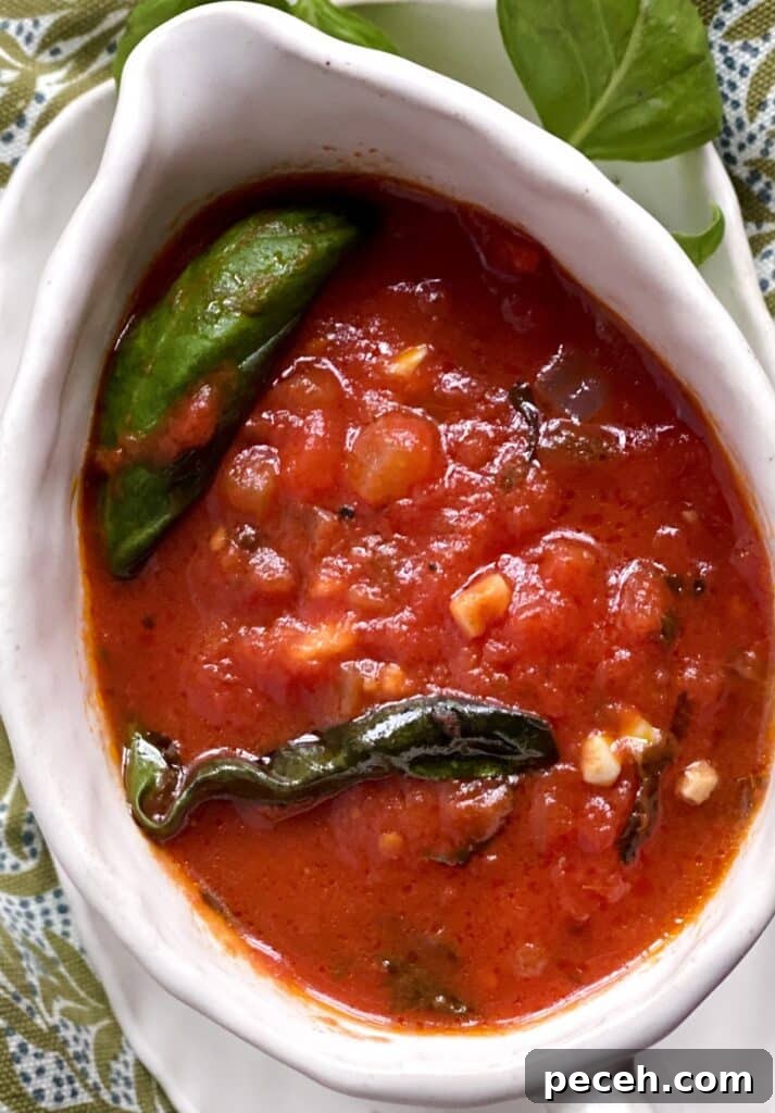 Authentic Meatless Sugo: Italian Tomato and Basil Sauce Recipe 3 Tomato basil sauce in gravy boat.