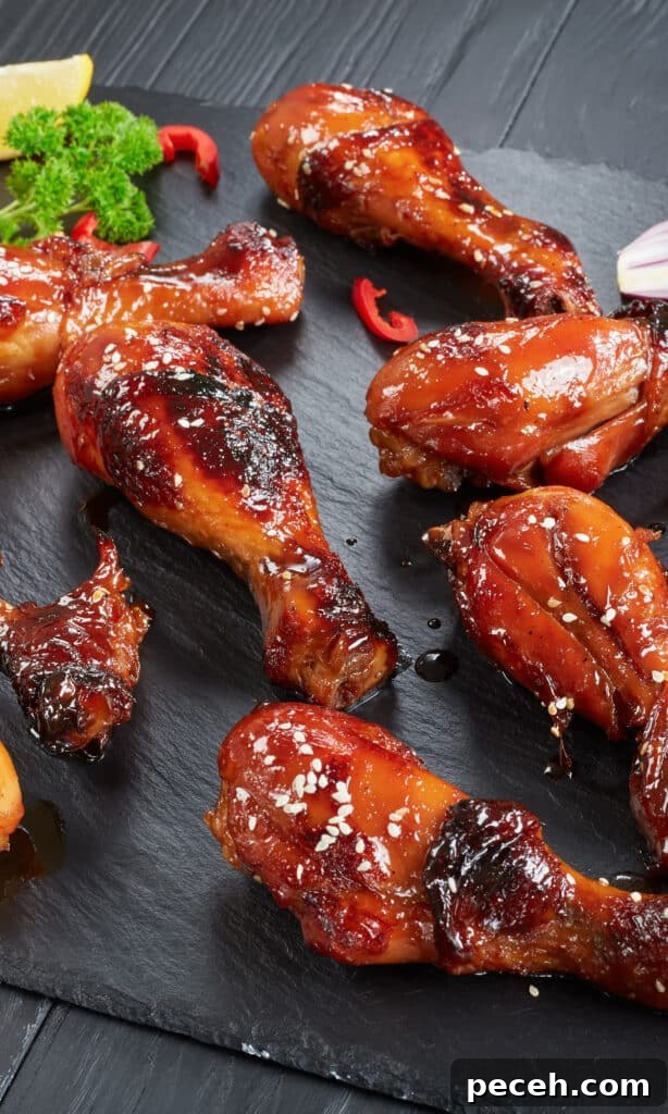 Zesty Drunken Chicken: Tangy, Tipsy Roast Chicken Recipe 4 zesty drunken chicken legs on slate.