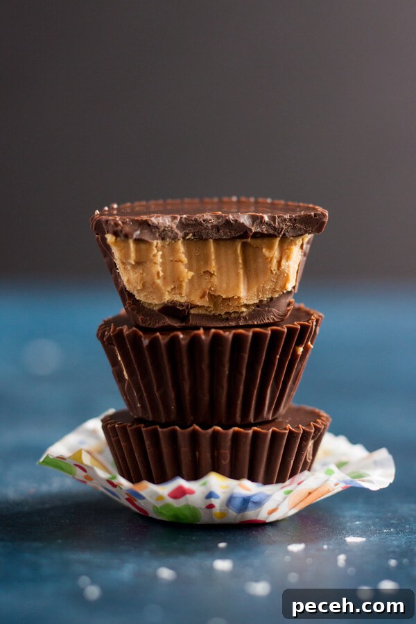 A stack of Homemade Peanut Butter Cups with one half eaten on top