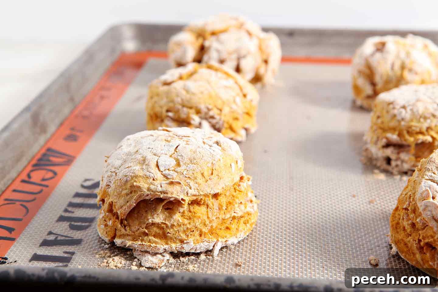 Vegan Pumpkin Biscuits with Maple Cinnamon Butter 4 Close up of pumpkin biscuits on baking sheet