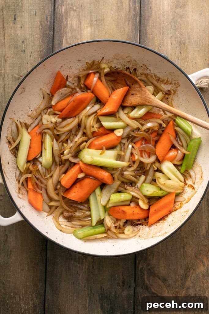 cooked onions, carrots and celery in a dutch oven.