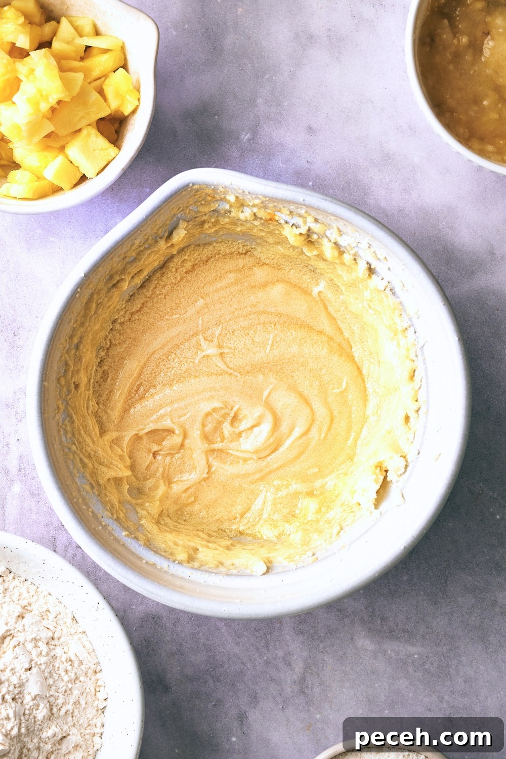Tropical Hawaiian Banana Bread with Coconut and Macadamia Nuts 8 A mixing bowl with the wet ingredients mixed.