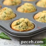 Savory Cheddar & Spinach Muffins Recipe for Quick Breakfast 7 Close up on a Cheddar and Spinach Muffin in the muffin pan