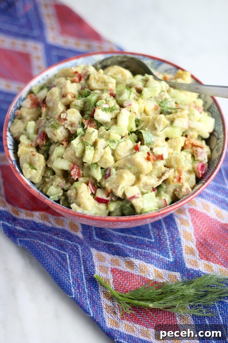 Paleo Plantain "Potato" Salad (AIP) - this potato-free salad tastes just like the original, thanks to plantains, avocado ranch dressing, and crispy veggies and bacon! | fedandfulfilled.com