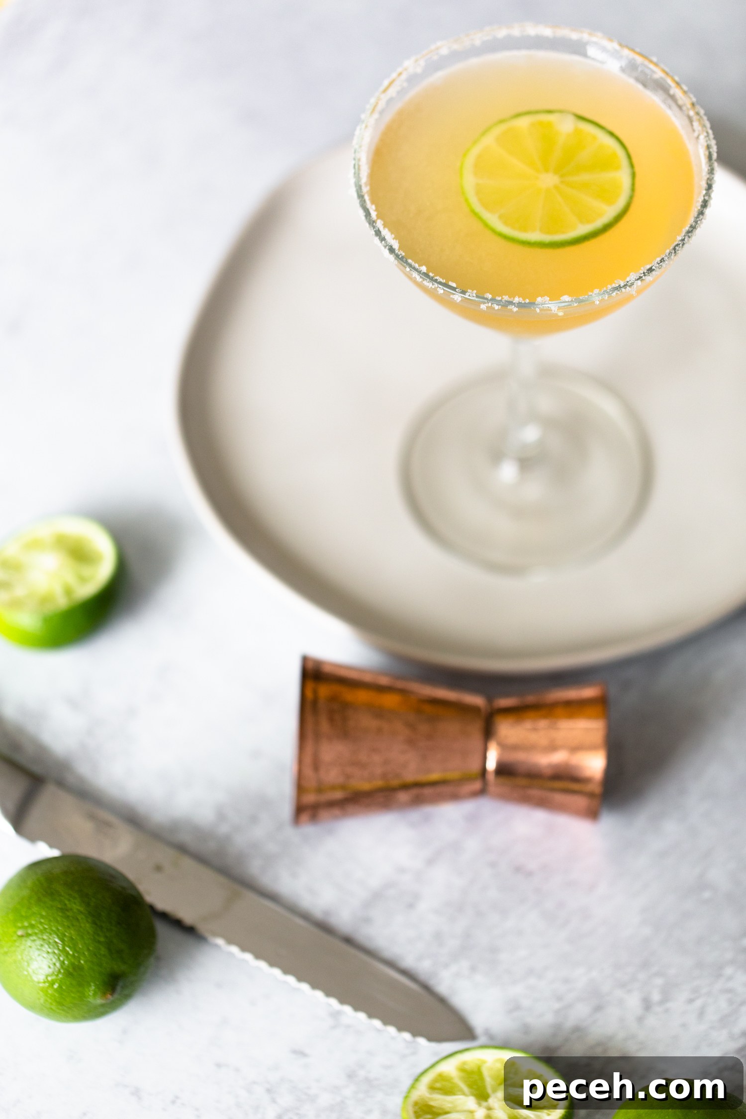 Italian Margarita in a martini glass with a lime wheel. Italian Margarita