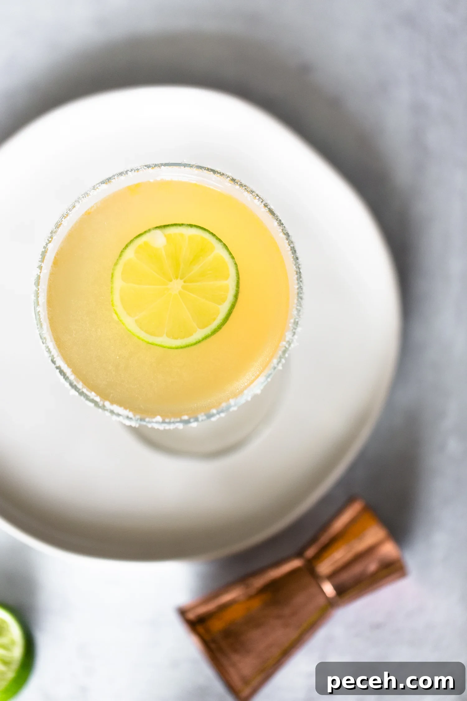 Italian Margarita in a martini glass from above. Italian Margarita from above with a slice of lime
