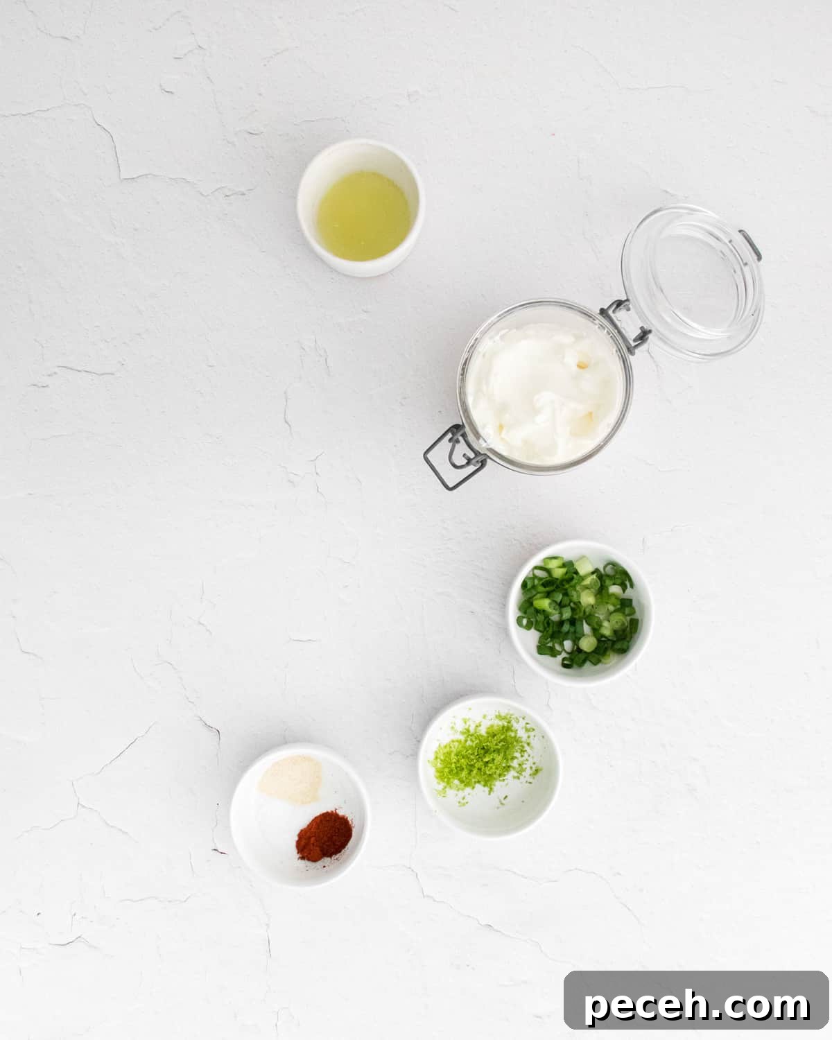 Chili Lime Chicken Wings with Tangy Dipping Sauce 9 Ingredients for sour cream dip in small bowls.