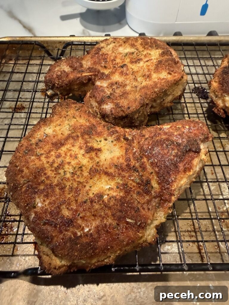 Pickle-Brined Fried Pork Chops with Creamy Dill-Dijon Gravy 5 The finished chops on a rack before being topped with gravy