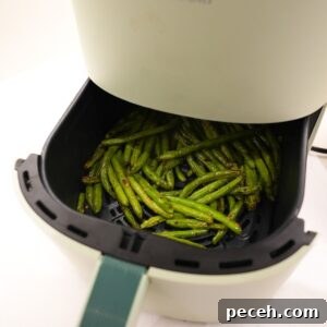 Green beans in an air fryer.