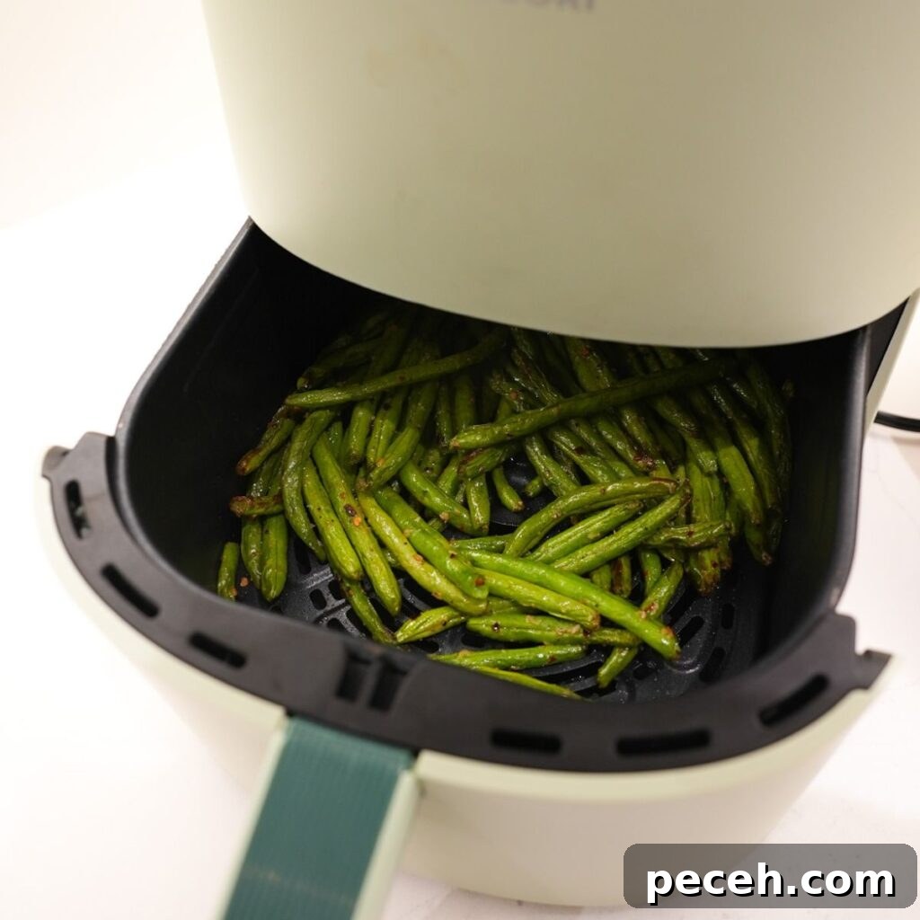 Green beans in an air fryer.