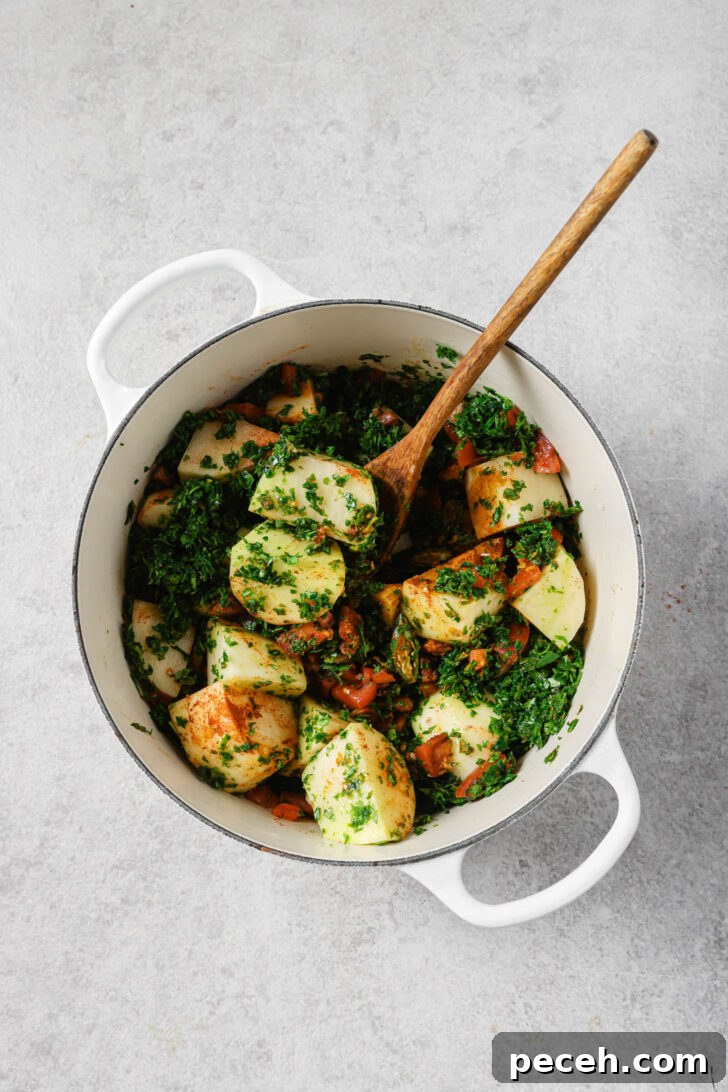 Authentic Aloo Methi (Potato & Fenugreek Leaves) Recipe from Mom-in-Law 12 Aloo methi ingredients in a dutch oven ready to be cooked