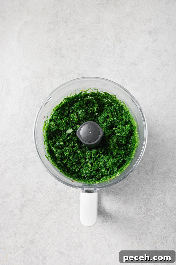 Authentic Aloo Methi (Potato & Fenugreek Leaves) Recipe from Mom-in-Law 9 Chopped fenugreek leaves in a food processor