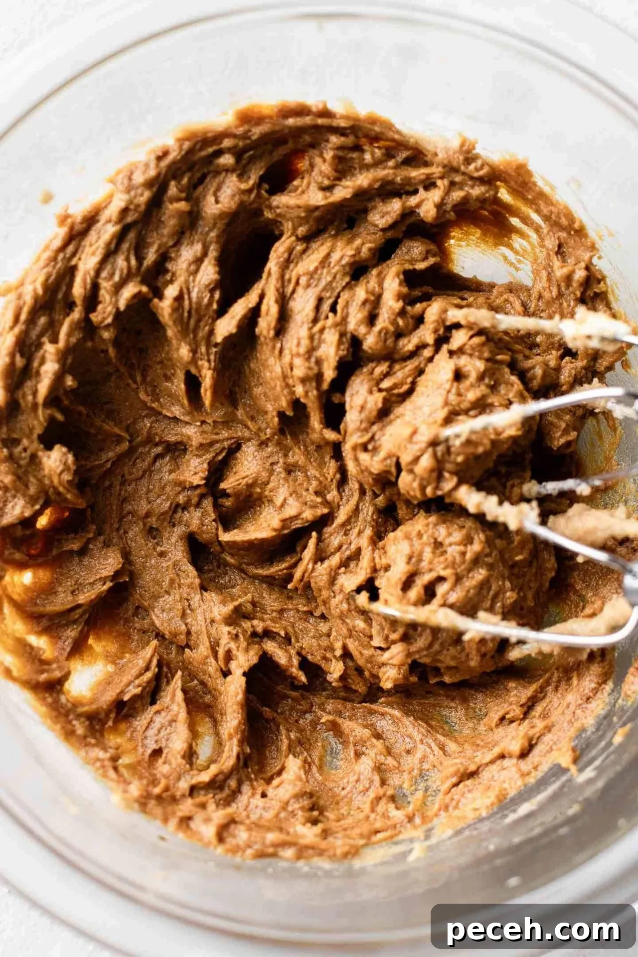 wet ingredients for gingerbread cookie dough mixed together in bowl