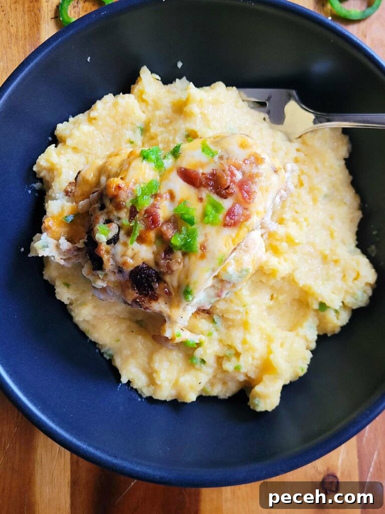 plate of jalapeno popper chicken with cheesy polenta