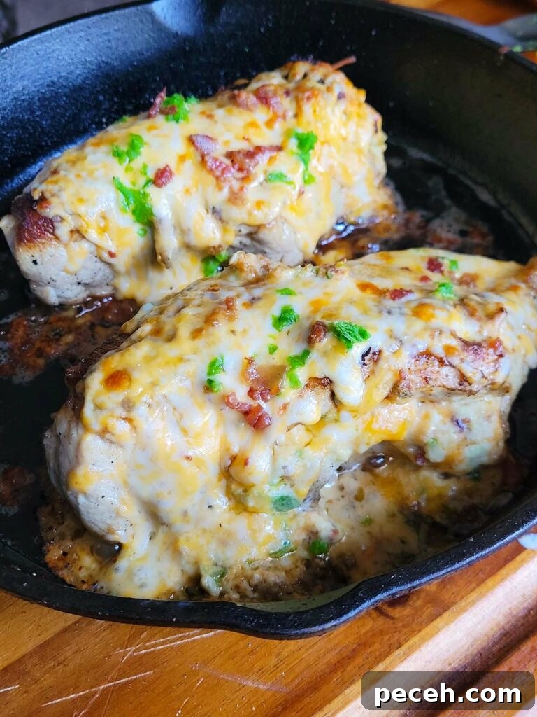 cheesy jalapeno stuffed chicken breast in a cast iron pan