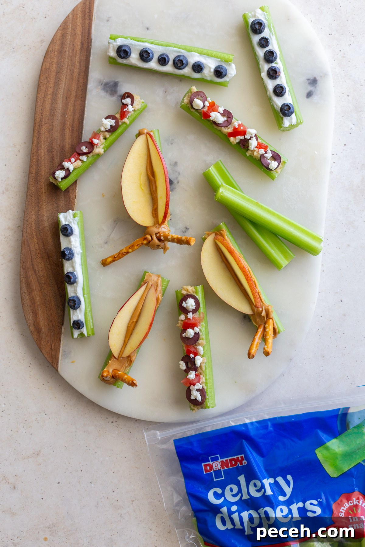 Closeup of celery dippers topped with yogurt and berries