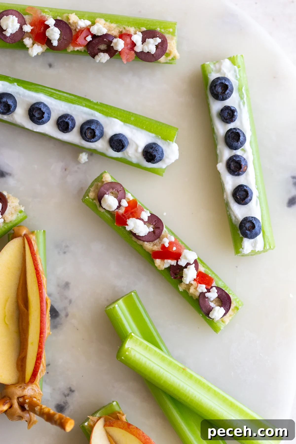 Ants on a Log: 3 Fun Variations for Snacks and Parties 5 Assorted celery snacks on a tray