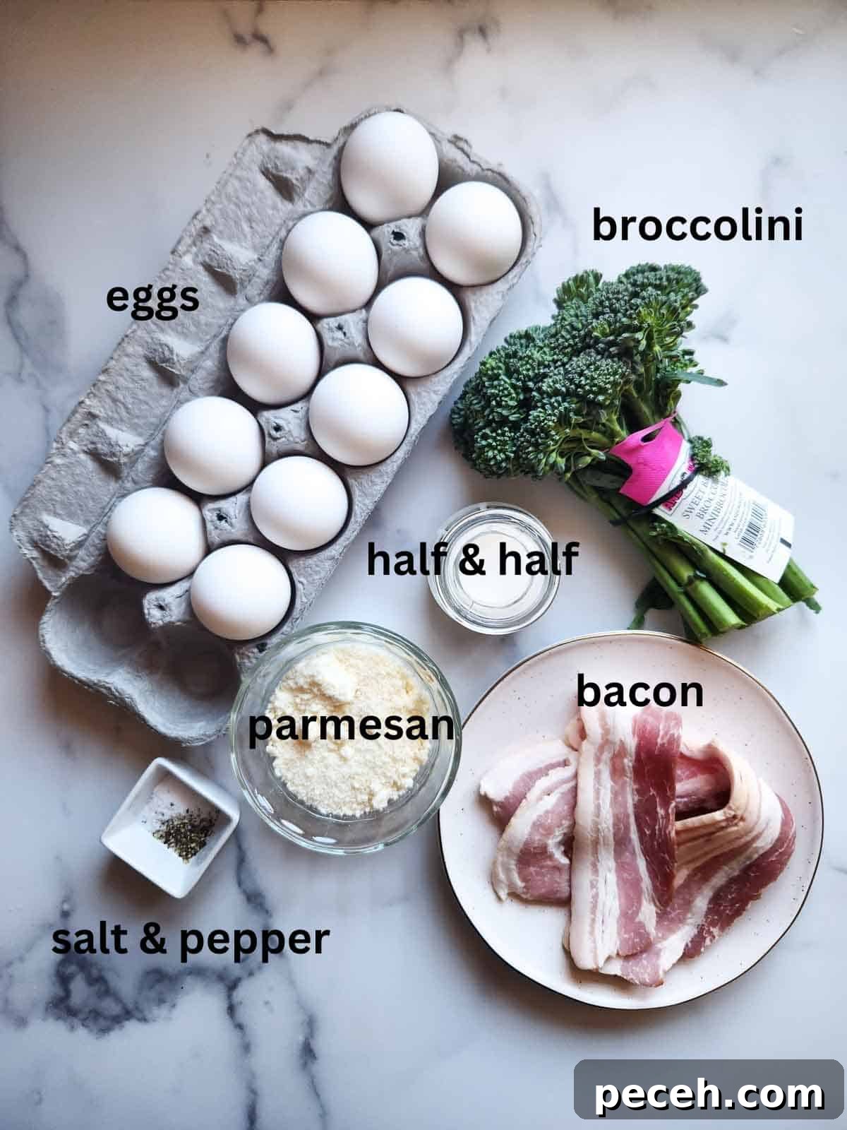 Overhead view of broccolini frittata ingredients on white marble.