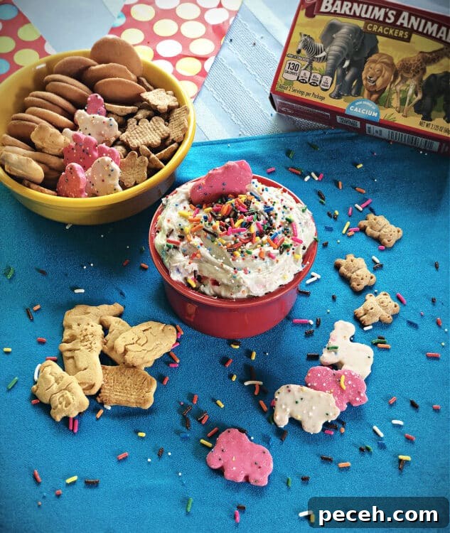 Dunkaroos Cake Batter Confetti Dip Recipe 5 bowl of dip garnished with sprinkles and surrounded by cookies and crackers for dipping