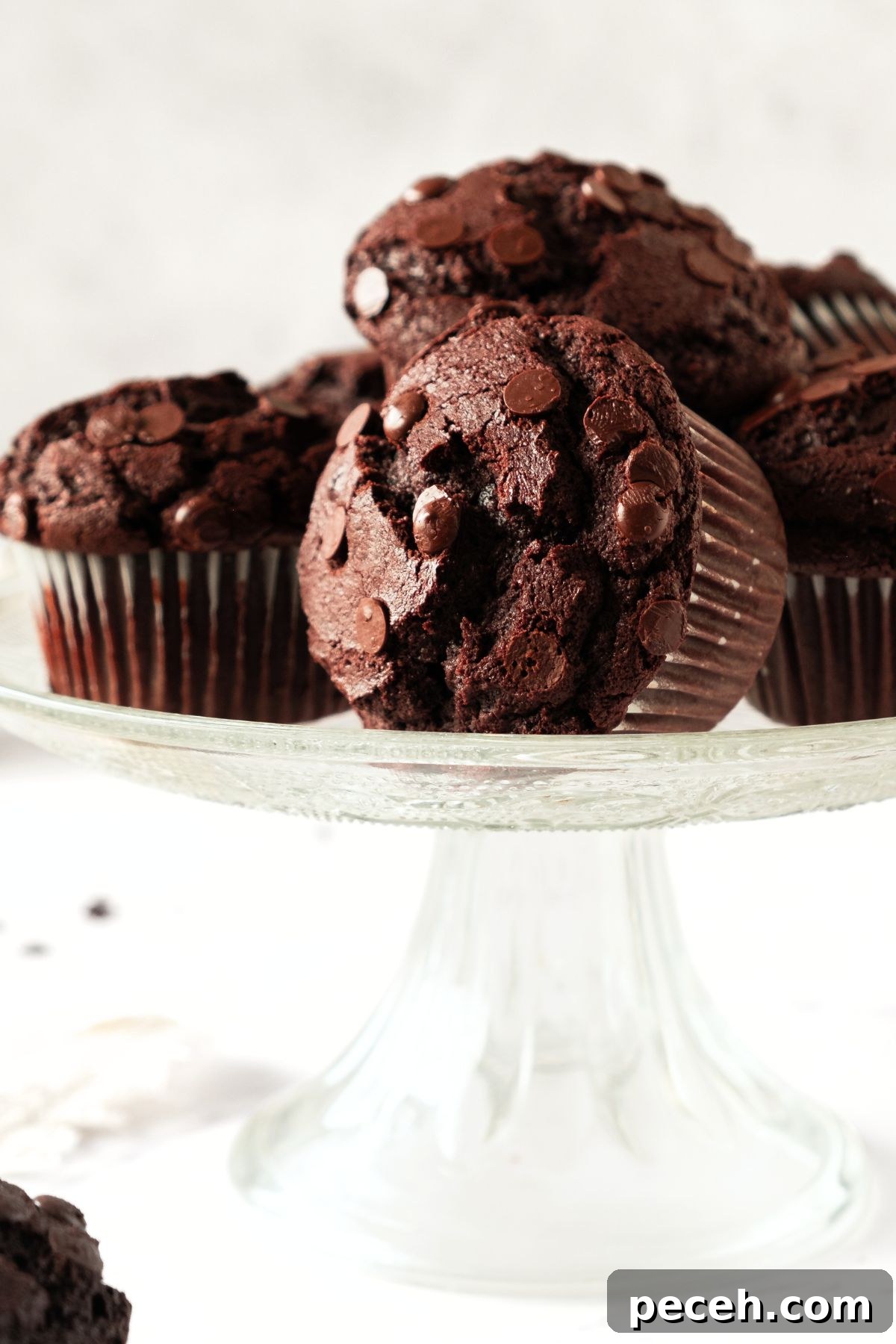 Gluten-Free Double Chocolate Muffin Recipe Gluten-free double chocolate muffins on cake stand