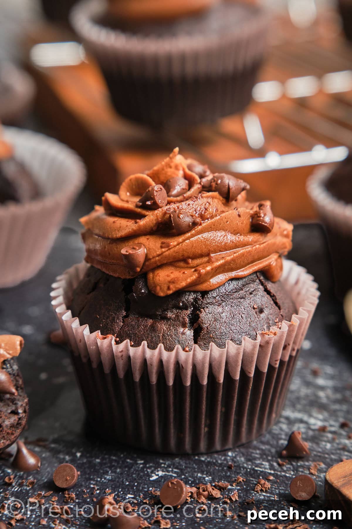 Decadent Chocolate Cupcakes with Silky Chocolate Frosting 2 Zoom-in on a chocolate cupcake with chocolate frosting.