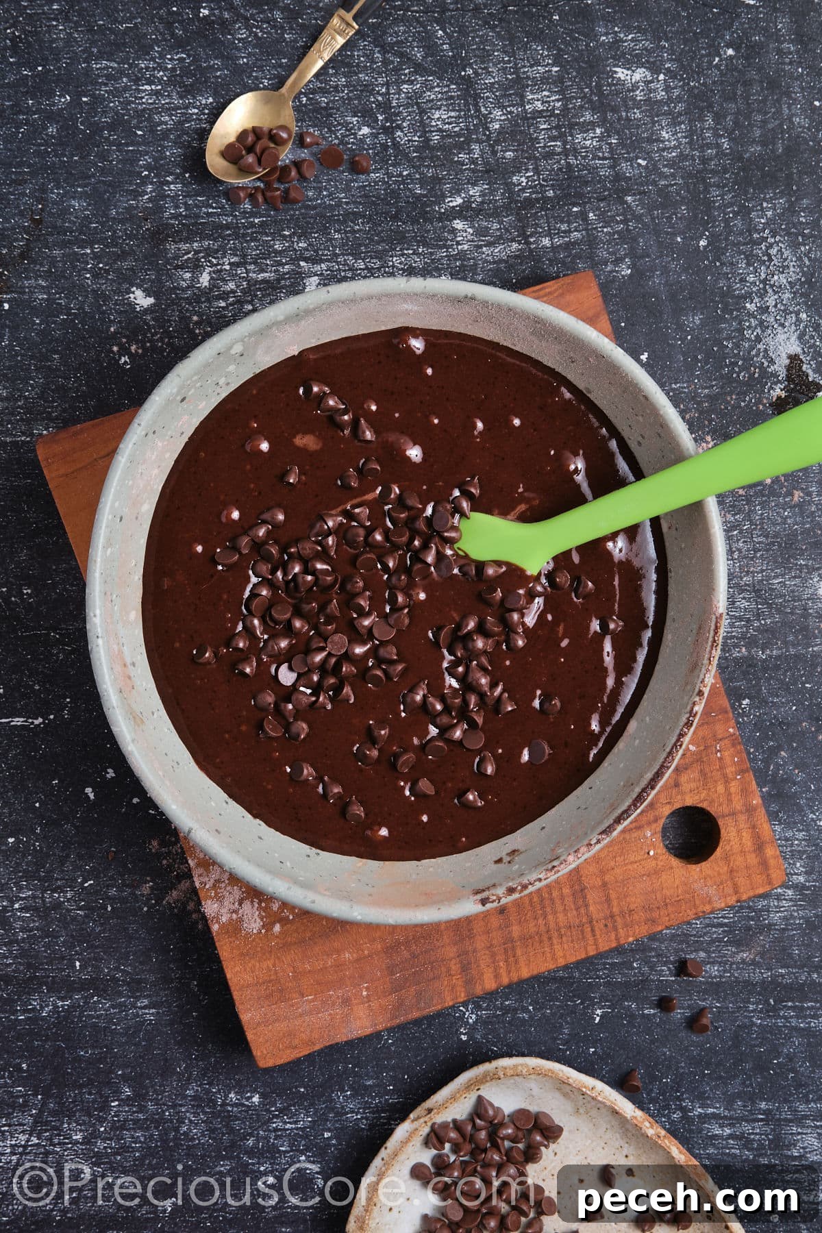 Decadent Chocolate Cupcakes with Silky Chocolate Frosting 10 Wet ingredients mixed in with dry ingredients and chocolate chips added.