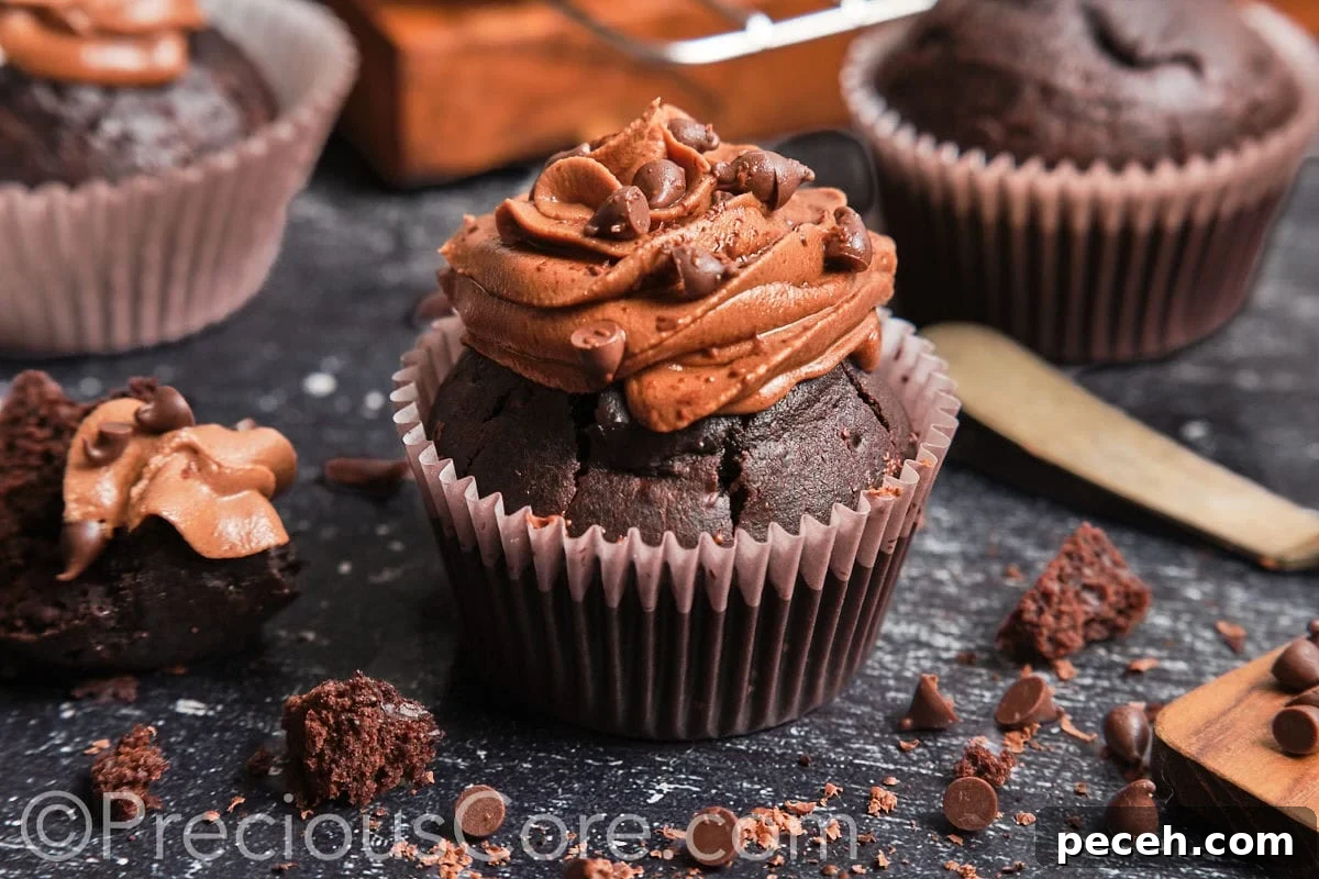 Decadent Chocolate Cupcakes with Silky Chocolate Frosting 3 Landscape image of a moist chocolate cupcake.