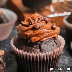 Decadent Chocolate Cupcakes with Silky Chocolate Frosting 18 Zoom-in on a chocolate cupcake with chocolate frosting.