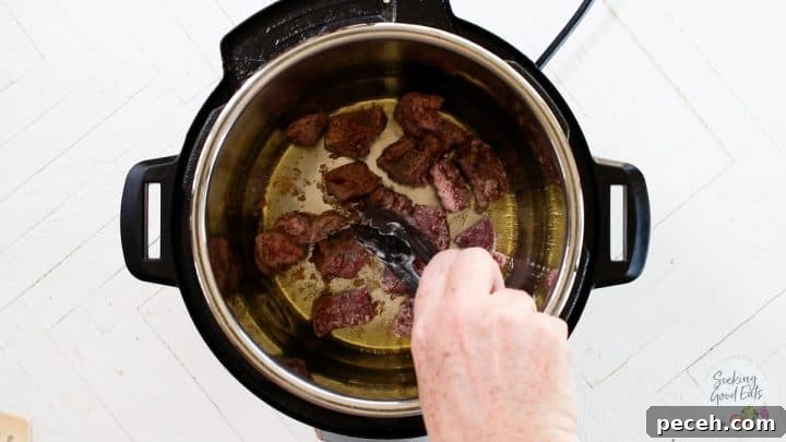 Instant Pot Lamb Stew Recipe: Tender, Flavorful One-Pot Meal 4 Searing the lamb in the Instant Pot