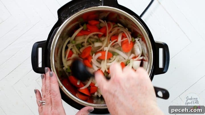 Instant Pot Lamb Stew Recipe: Tender, Flavorful One-Pot Meal 5 Carmelizing the vegetables in the Instant Pot.