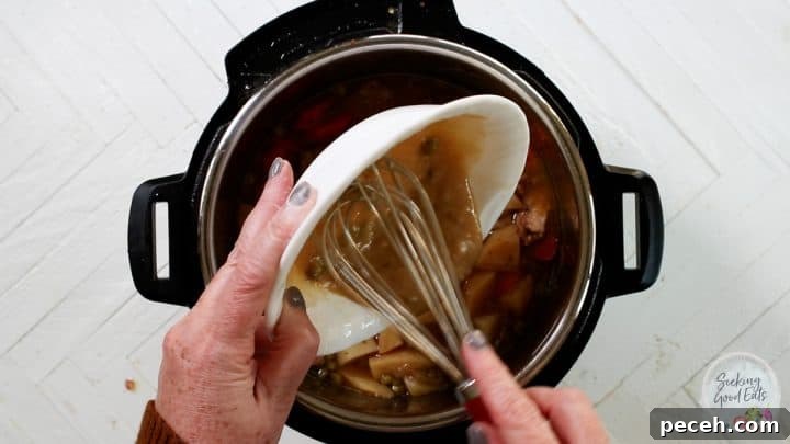 Instant Pot Lamb Stew Recipe: Tender, Flavorful One-Pot Meal 7 Mixing flour and juices in the Instant Pot to thicken the lamb stew.