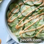 spicy cucumber salad topped with sriracha mayo