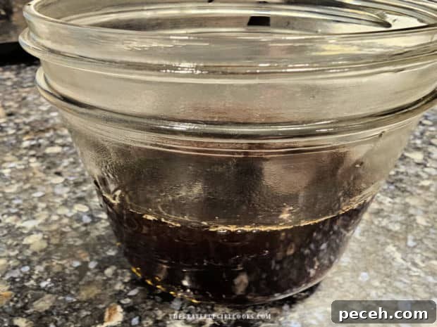 Honey Almond Iced Latte - The Grateful Girl Cooks! Very strong brewed hot coffee is added to a pint sized canning jar.