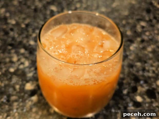 Honey Almond Iced Latte - The Grateful Girl Cooks! A glass full of a honey almond iced latte before a topping is added.